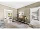 Well-lit room with hardwood floors and light neutral paint, showcases both the dining and living rooms at 8712 Admirals Bay Dr, Indianapolis, IN 46236