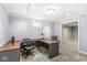 Office in basement with desk and chairs, offering a dedicated workspace in a neutral setting at 8712 Admirals Bay Dr, Indianapolis, IN 46236