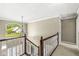 Elegant staircase featuring a chandelier and large arched window providing natural light at 8712 Admirals Bay Dr, Indianapolis, IN 46236