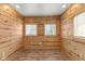 Cozy room with wood paneled walls, wood floor and windows to let the natural light in at 89 S Grant St, Martinsville, IN 46151