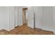 Laminate floored bedroom with closet and access to another room at 89 S Grant St, Martinsville, IN 46151