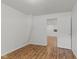 This bedroom features neutral paint and wood-look floors at 89 S Grant St, Martinsville, IN 46151