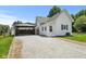 Exterior showcasing the gravel driveway leading to a covered carport at 89 S Grant St, Martinsville, IN 46151