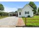 Charming home showcasing a well-manicured lawn and a convenient carport at 89 S Grant St, Martinsville, IN 46151