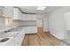 This kitchen features white cabinets, countertops, and stainless appliances at 89 S Grant St, Martinsville, IN 46151