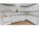 This kitchen features white cabinets, countertops, and stainless appliances at 89 S Grant St, Martinsville, IN 46151