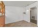 Bright sunroom with white walls and wood-paneled walls for comfort at 89 S Grant St, Martinsville, IN 46151