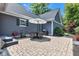 Inviting outdoor patio with seating and umbrella, perfect for al fresco dining and summer barbecues at 900 W Busby St, Lebanon, IN 46052
