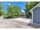 Wide driveway leading to a backyard with a gazebo, providing ample parking and outdoor enjoyment space at 900 W Busby St, Lebanon, IN 46052