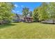 Expansive backyard featuring a gazebo, lush lawn, and mature trees, perfect for outdoor gatherings and relaxation at 900 W Busby St, Lebanon, IN 46052