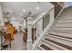 Finished basement with carpeted stairs, wood flooring, accent chairs, and recessed lighting at 900 W Busby St, Lebanon, IN 46052