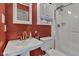 Cozy bathroom with white vanity, toilet, and a glass-enclosed shower, providing a clean and functional space at 900 W Busby St, Lebanon, IN 46052