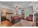 Spacious bedroom with wood floors, decorative rug, ceiling fan, and a feature wall at 900 W Busby St, Lebanon, IN 46052