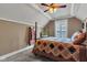 Charming bedroom with unique quilt, ceiling fan, and ample natural light at 900 W Busby St, Lebanon, IN 46052