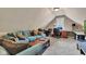 Upstairs bonus room featuring a sofa, desk, and comfortable lounging space at 900 W Busby St, Lebanon, IN 46052