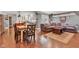 Open-concept dining and living area showcasing hardwood floors and ample natural light at 900 W Busby St, Lebanon, IN 46052