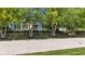 Beautifully landscaped home with mature trees providing curb appeal and a sense of established charm at 900 W Busby St, Lebanon, IN 46052