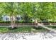 Landscaped front yard with mature birch trees complimenting this home's exterior at 900 W Busby St, Lebanon, IN 46052