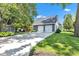 Beautiful two-car garage exterior with driveway and well-manicured lawn at 900 W Busby St, Lebanon, IN 46052