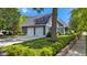 Spacious two-car garage attached to a well-kept home, surrounded by lush lawn and manicured landscaping at 900 W Busby St, Lebanon, IN 46052