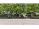 Inviting home with mature trees lining the front, offering shade and enhancing privacy from the street at 900 W Busby St, Lebanon, IN 46052