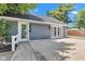 Detached garage with double doors, offering ample parking and storage space for vehicles and equipment at 900 W Busby St, Lebanon, IN 46052