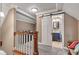 Hallway with access to the en-suite bathroom via a white barn door at 900 W Busby St, Lebanon, IN 46052