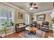Comfortable living room with hardwood floors, neutral walls, and a ceiling fan at 900 W Busby St, Lebanon, IN 46052
