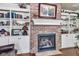Close up on a brick fireplace with mantle and bookshelves at 900 W Busby St, Lebanon, IN 46052