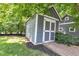 Charming outbuilding with double doors, ideal for storage or hobbies, adding character to the property at 900 W Busby St, Lebanon, IN 46052