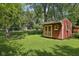 Backyard shed offering ample storage, set on a well-manicured lawn at 9014 Holliday Dr, Indianapolis, IN 46260