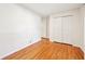 Simple bedroom with hardwood floors and a double closet at 9014 Holliday Dr, Indianapolis, IN 46260