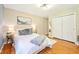 Comfortable bedroom with neutral walls, hardwood floors, and a plush rug at 9014 Holliday Dr, Indianapolis, IN 46260