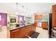 Modern kitchen with an expansive island, stylish pendant lighting, and stainless steel appliances at 9014 Holliday Dr, Indianapolis, IN 46260