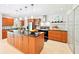 Open concept kitchen with a center island, stainless steel appliances, and modern lighting fixtures at 9014 Holliday Dr, Indianapolis, IN 46260