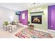 Stylish living room featuring a cozy fireplace, modern decor, and a vibrant color palette, creating a welcoming atmosphere at 9014 Holliday Dr, Indianapolis, IN 46260
