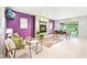 Modern living room with a fireplace, colorful decor, and a sliding glass door to the outdoors at 9014 Holliday Dr, Indianapolis, IN 46260