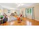 Spacious living room with hardwood floors, large windows, and stylish decor, perfect for relaxing or entertaining at 9014 Holliday Dr, Indianapolis, IN 46260