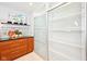 Well-organized pantry with sliding doors and ample shelving for storage at 9014 Holliday Dr, Indianapolis, IN 46260