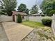 Backyard shed with concrete patio and fenced yard at 9099 Ne Oak St, Alexandria, IN 46001
