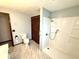 Bathroom featuring a shower, toilet, and spacious layout at 9099 Ne Oak St, Alexandria, IN 46001