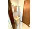 Bathroom featuring a single sink vanity, a mirror and a wooden door at 9099 Ne Oak St, Alexandria, IN 46001
