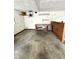 A workbench area in the garage with storage, shelving, and lighting for projects at 9099 Ne Oak St, Alexandria, IN 46001