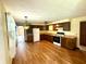 Traditional kitchen featuring wood cabinets, appliances, and durable laminate flooring at 9099 Ne Oak St, Alexandria, IN 46001