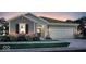 Charming one-story home with gray siding, brick accents, a two-car garage, and well-maintained landscaping at 9353 Corbett Dr, McCordsville, IN 46055