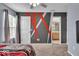 This bedroom has a large window and access to an ensuite bathroom at 9834 Belcrest Ln, Indianapolis, IN 46256