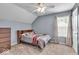 Cozy bedroom featuring a window with natural light and a ceiling fan for added comfort at 9834 Belcrest Ln, Indianapolis, IN 46256