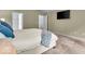 Bright primary bedroom featuring neutral walls and carpet with a wall-mounted TV for cozy relaxation at 9834 Belcrest Ln, Indianapolis, IN 46256