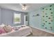 Cozy bedroom with playful climbing wall, cabinet and natural light at 9834 Belcrest Ln, Indianapolis, IN 46256