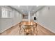A bright, open dining area with wood floors and a wooden table, perfect for Gathering gatherings at 9834 Belcrest Ln, Indianapolis, IN 46256